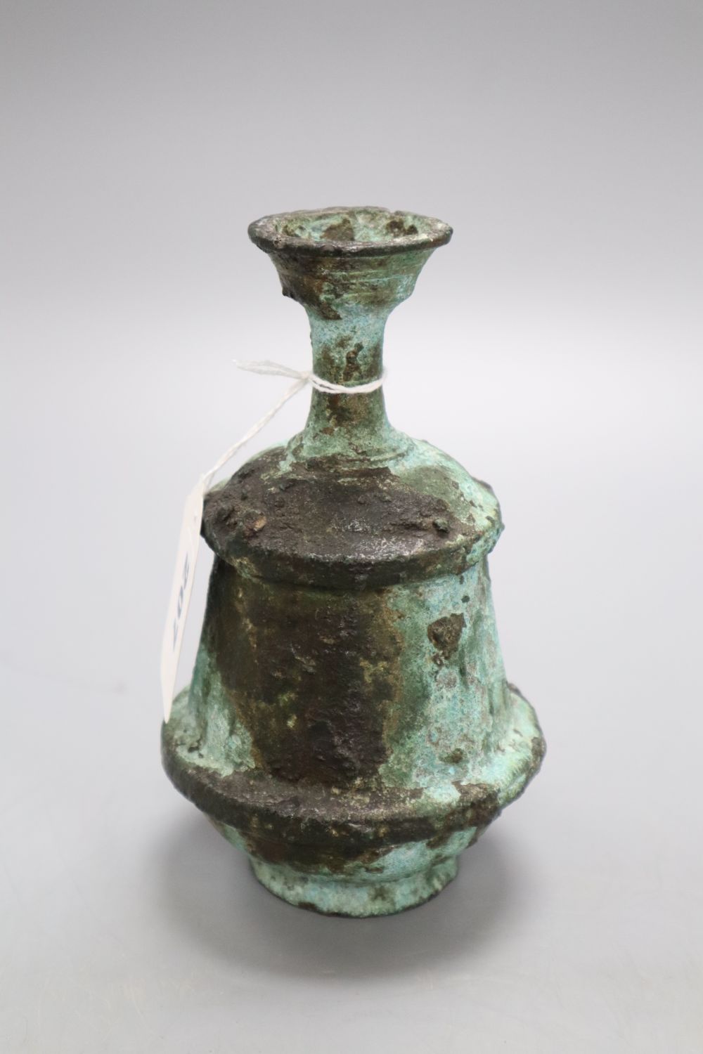 A Roman style oil bottle, height 16cm